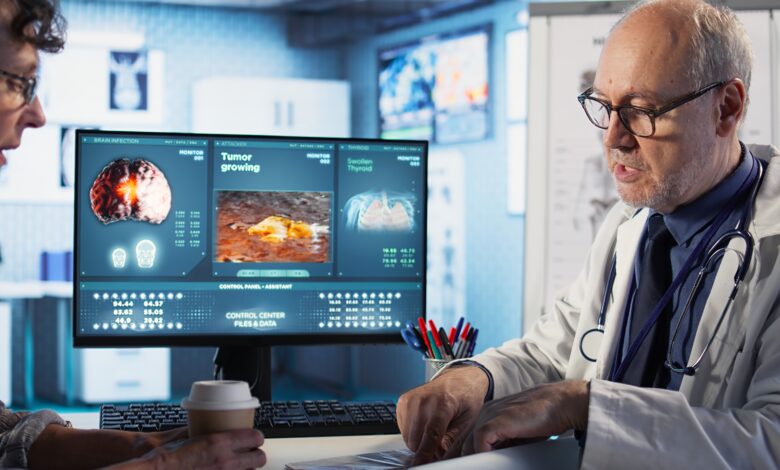 Specialist and old woman discuss x ray scan for preventive cancer medicine